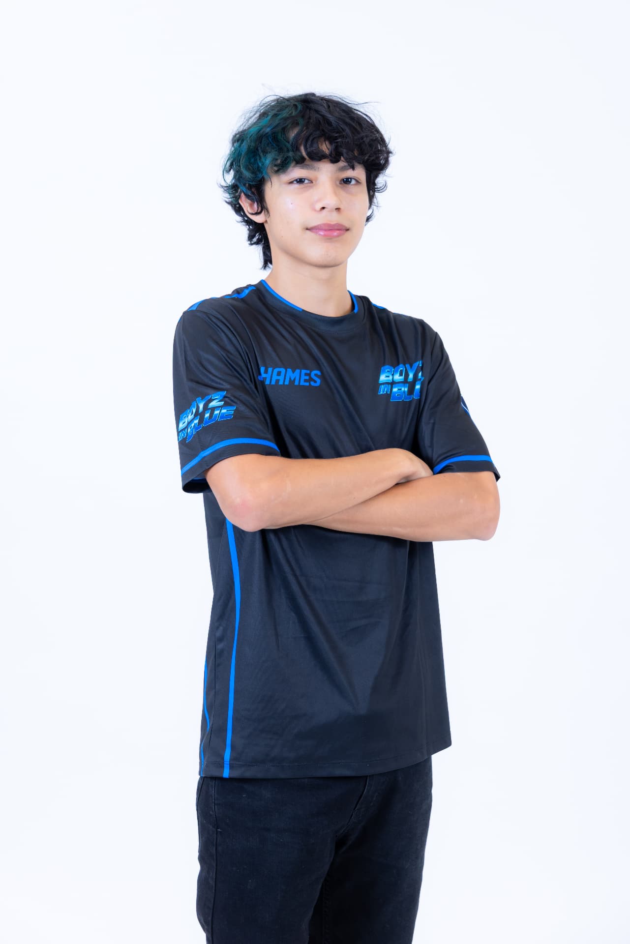 BOYZ IN BLUE performer in branded jersey with arms crossed