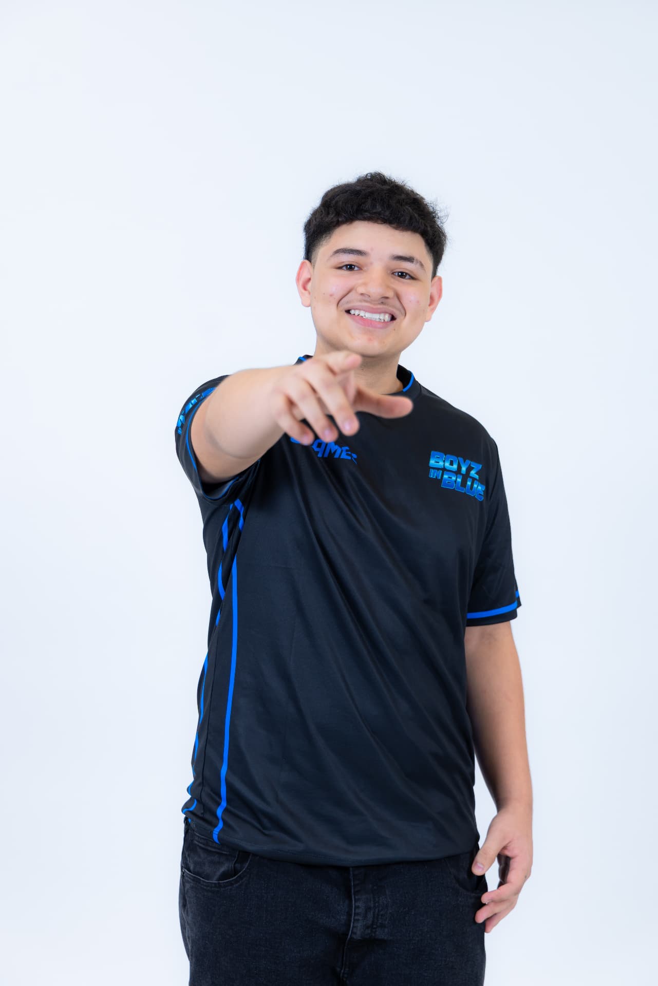 BOYZ IN BLUE performer in branded jersey pointing at the camera