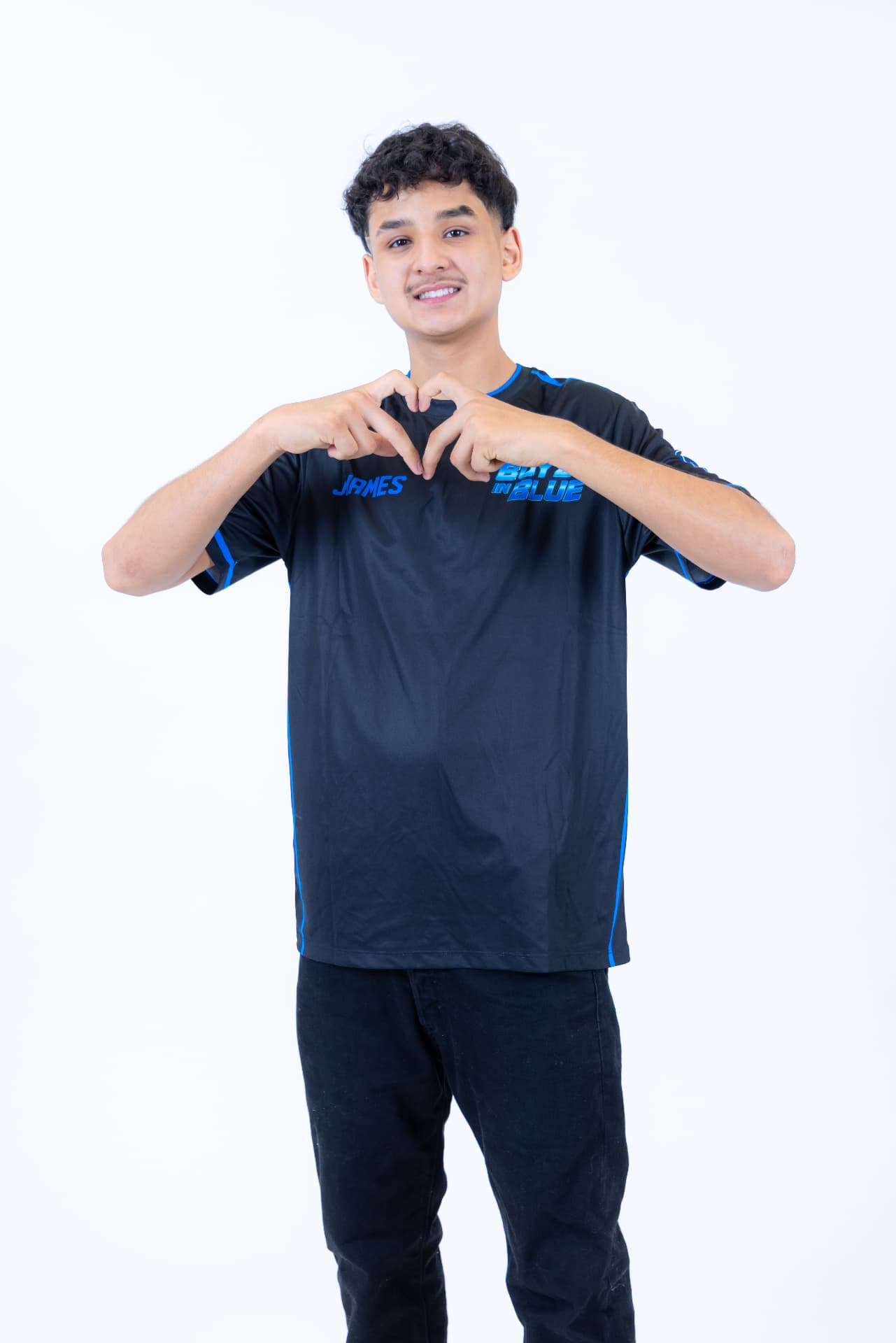 BOYZ IN BLUE performer James making a heart sign